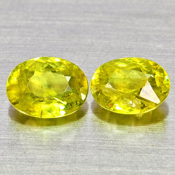 Natural Yellow Green Sphene Gemstones Titanium Red Spark 1.75 Ct. 2 Pcs. Oval Shape 6.8 x 5.3 Mm.: Product ID: 806509052 Product Name: Natural Sphene Weight: 1.75 CT. Size: 6.8 x 5.3 x 3.2 MM. Shape: Oval Color: Intense Yellow Green With Red Spark Clarity:SI1 Luster: Good Gems Origin: Madagascar Tr