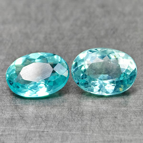 Natural Paraiba Color Apatite Gemstones 1.61 Ct. 2 Pcs. Oval Shape 7.2 x 5.2 Mm.: Product ID: 800613567 Product Name: Natural Apatite Weight: 1.61 CT. Size: 7.2 x 5.2 x 3.2 MM. Shape: Oval Color: Neon Blue Clarity:VSI Luster: Very Good Gems Origin: Tanzania Treatment: Unheated Crys