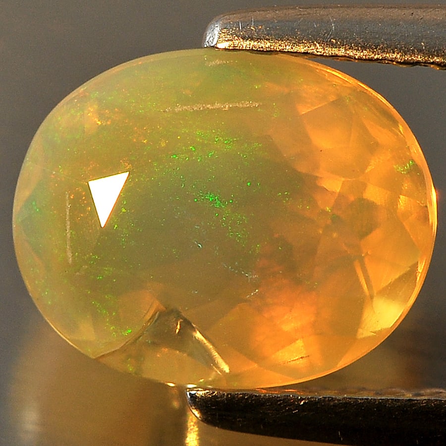 Natural Multi Color Opal Gemstones 1.49 Ct. Oval Shape 9 x 7.3 Mm.: Product ID: 818709576 Product Name: Natural Opal Weight: 1.49 CT. Size: 9 x 7.3 x 5 MM. Shape: Oval Color: Multi Color Clarity:Semi - Transparent Luster: Good Gems Origin: Ethiopia Treatment: Unheated