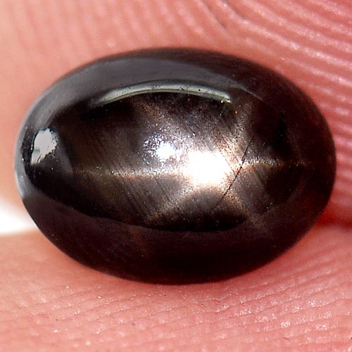 Natural Black Star Sapphire Gemstones 1.49 Ct. Oval Cabochon Shape 7 x 5.2 Mm.: Product ID: 806136507 Product Name: Natural Star Sapphire Weight: 1.49 CT. Size: 7 x 5.2 x 3.5 MM. Shape: Oval Cabochon Color: Black Clarity:Opaque Luster: Good 6 Rays Star Gems Origin: Thailand Treat