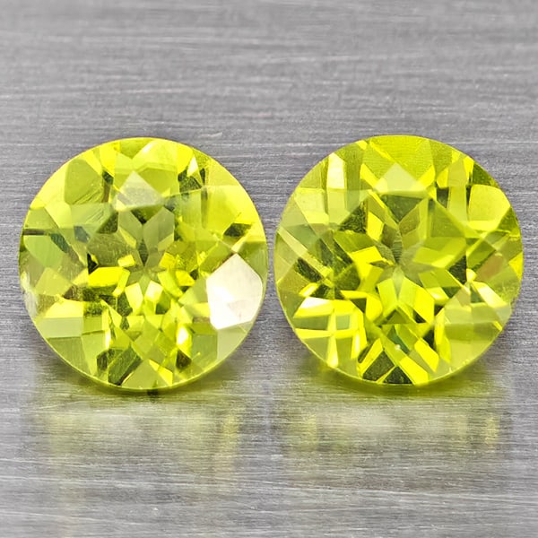 Natural Green Peridot Gemstones 1.29 Ct. 2 Pcs. Round Shape 5.2 Mm.: Product ID: 805317604 Product Name: Natural Peridot Weight: 1.29 CT. Size: 5.2 x 5.2 x 3.5 MM. Shape: Round Color: Green Clarity:VSI Luster: Good Gems Origin: Pakistan Treatment: Unheated Crystal Stru