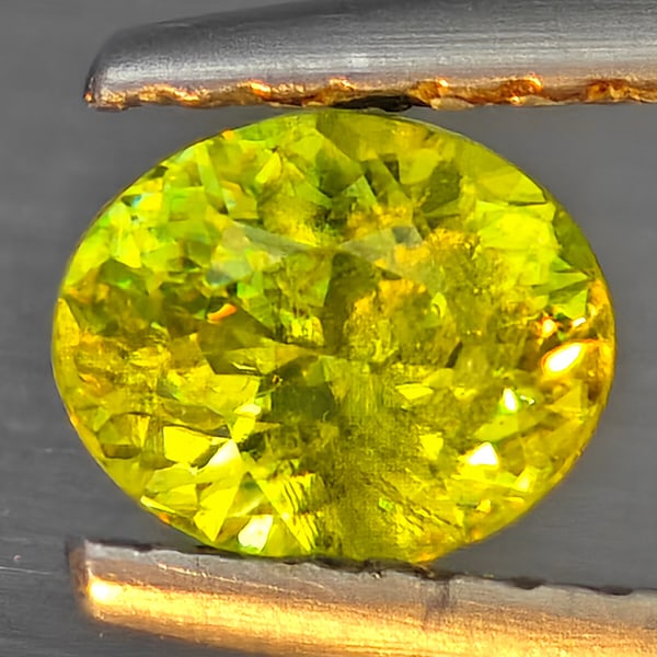 Natural Multi-Color With Rainbow Spark Sphene Gemstones 0.54 Ct. Oval Shape 5.5 x 4.4 Mm.: Product ID: 806509280 Product Name: Natural Sphene Weight: 0.54 CT. Size: 5.5 x 4.4 x 3.4 MM. Shape: Oval Color: Multi-Color Clarity:SI1 Luster: Good Gems Origin: Madagascar Treatment: Unheated Crysta
