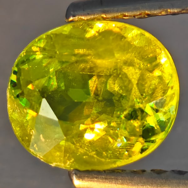 Natural Multi-Color With Rainbow Spark Sphene Gemstones 1.27 Ct. Oval Shape 7.1 x 6.1 Mm.: Product ID: 806509134 Product Name: Natural Sphene Weight: 1.27 CT. Size: 7.1 x 6.1 x 3.9 MM. Shape: Oval Shape Color: Multi-Color With Rainbow Spark Clarity:SI1 Luster: Good Gems Origin: Madagascar T