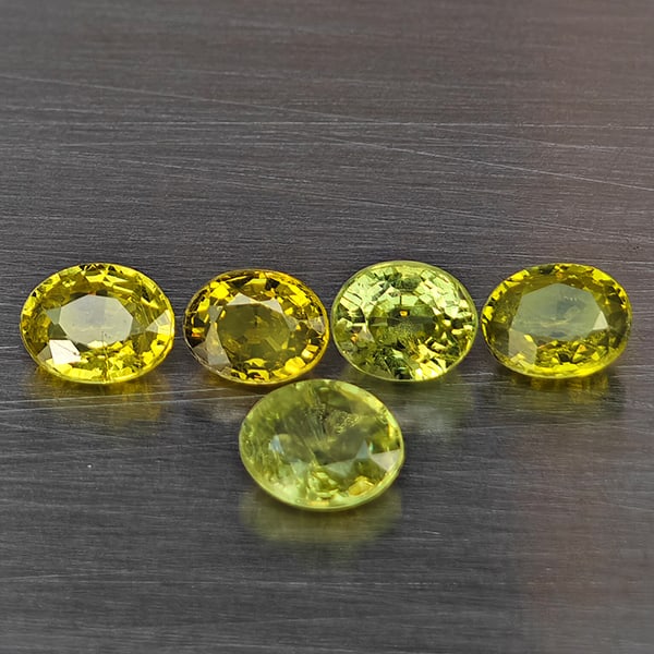 Natural Greenish Yellow Titanium Sphene Gemstones Rainbow Spark 1.46 Ct. 5 Pcs. Oval Shape 4.5 x 3.5: Product ID: 806509406 Product Name: Natural Sphene Weight: 1.46 CT. Size: 4.5 x 3.5 x 2.3 MM. Shape: Oval Shape Color: Greenish Yellow Titanium Rainbow Spark Clarity:SI1 Luster: Good Gems Origin: Mada