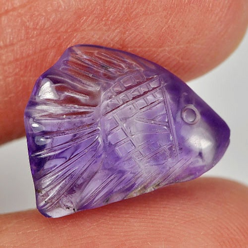Natural Purple Amethyst Gemstones 5.91 Ct. Fish Carving Shape 15.7 x 11.1 Mm.: Product ID: 810303398 Product Name: Natural Amethyst Weight: 5.91 CT. Size: 15.7 x 11.1 x 5.7 MM. Shape: Fish Carving Color: Purple Clarity:Semi - Transparent Luster: Good Gems Origin: Brazil Treatmen