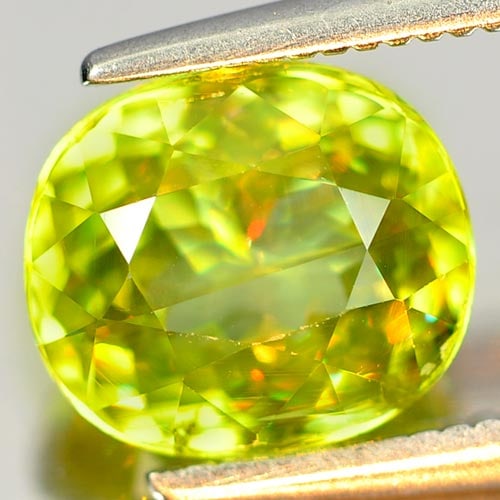Natural Multi Color Sphene Gemstones 2.61 Ct. Cushion Shape 8.4 x 7.3 Mm.: Product ID: 806505394 Product Name: Natural Sphene Weight: 2.61 CT. Size: 8.4 x 7.3 x 5 MM. Shape: Cushion Color: Intense Yellowish Green Titanium With Rainbow Clarity:VSI Luster: Adamantine Gems Orig