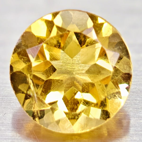 Natural Yellow Citrine Gemstones 1.31 Ct. Round Shape 7 Mm.: Product ID: 801813571 Product Name: Natural Citrine Weight: 1.31 CT. Size: 7 x 7 x 4.9 MM. Shape: Round Color: yellow Clarity:VVS Luster: Good Gems Origin: Barzil Treatment: Unheated Crystal Structure