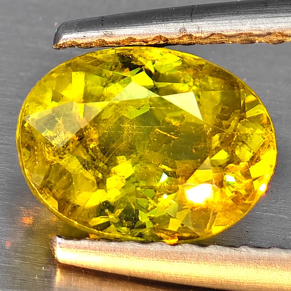 Natural Multi-Color With Rainbow Spark Sphene Gemstones 1.43 Ct. Oval Shape 7.8 x 6 Mm.: Product ID: 806509116 Product Name: Natural Sphene Weight: 1.43 CT. Size: 7.8 x 6 x 4.2 MM. Shape: Oval Shape Color: Multi-Color Clarity:SI1 Luster: Good Gems Origin: Madagascar Treatment: Unheated Cr