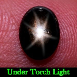 Natural Black Star Sapphire 6 Rays Gemstones 1.25 Ct. Oval Cabochon Shape 8.3 x 6.3 Mm.: Product ID: 806132834 Product Name: Natural Star Sapphire Weight: 1.25 CT. Size: 7.8 x 5.7 x 2.6 MM. Shape: Oval Cabochon Color: Black Clarity:Opaque Luster: Good 6 Rays Star Gems Origin: Thailand Tre