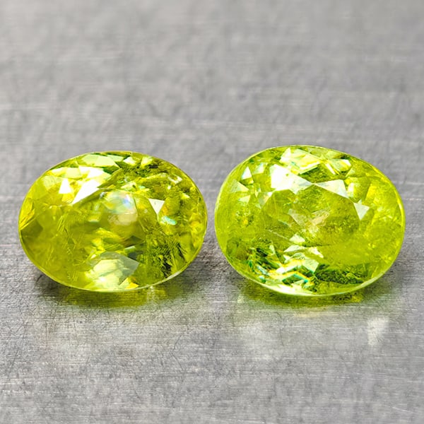 Natural Green Sphene Gemstones Red Spark 1.40 Ct. 2 Pcs. Oval Shape 5.8 x 4.6 Mm.: Product ID: 806509006 Product Name: Natural Sphene Weight: 1.40 CT. Size: 5.8 x 4.6 x 3.4 MM. Shape: Oval Color: Intense Yellow Green With Red Spark Clarity:SI Luster: Good Gems Origin: Madagascar Tre