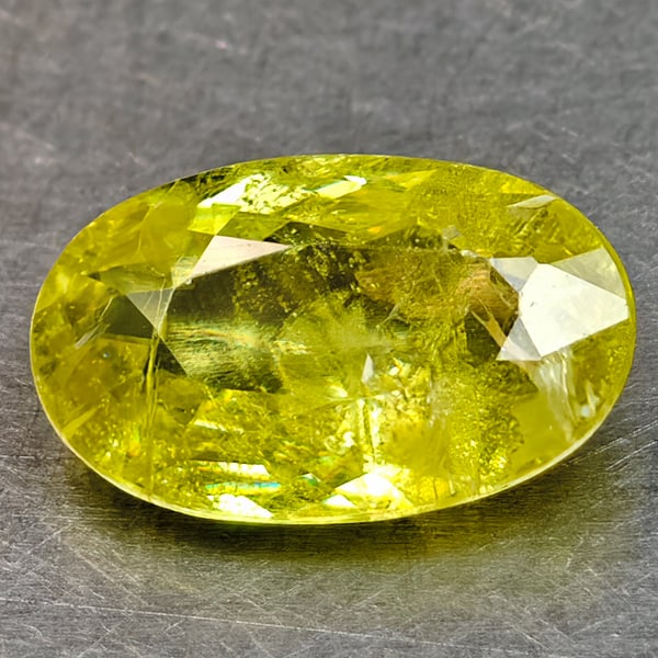 Natural Sphene Gemstones Intense Yellow Green Titanium Red Spark 0.92 Ct. Oval Shape 7.8 x 4.9 Mm.: Product ID: 806509034 Product Name: Natural Sphene Weight: 0.92 CT. Size: 7.8 x 4.9 x 2.8 MM. Shape: Oval Shape Color: Intense Yellow Green With Red Spark Clarity:SI1 Luster: Good Gems Origin: Madagas