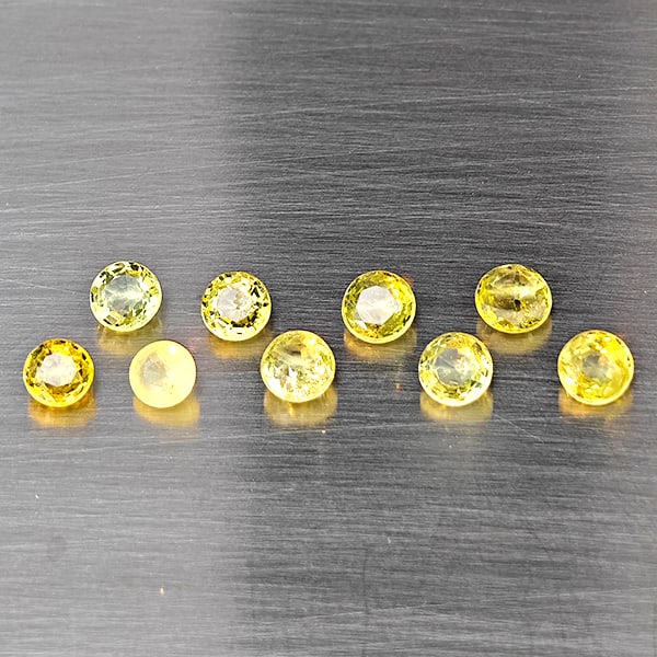 Natural Greenish Yellow Titanium Sphene Gemstones Rainbow Spark 1.34 Ct. 9 Pcs. Round Shape 3.5 Mm.: Product ID: 806509446 Product Name: Natural Sphene Weight: 1.34 CT. Size: 3.5 x 3.5 x 2.5 MM. Shape: Round Color: Greenish Yellow Titanium Rainbow Spark Clarity:SI1 Luster: Good Gems Origin: Madagasca