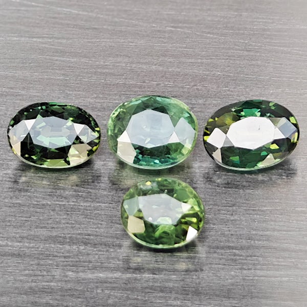 Natural Green Sapphire Gemstones 2.24 Ct. 4 Pcs. Oval Shape 5.8 x 4.3 Mm.: Product ID: 806162996 Product Name: Natural Green Sapphire Weight: 2.24 CT. Size: 5.8 x 4.3 x 2.5 to 5 x 4.2 x 3.2 MM. Shape: Oval Shape Color: Green Clarity:SI1 Luster: Good Gems Origin: Thailand Tre