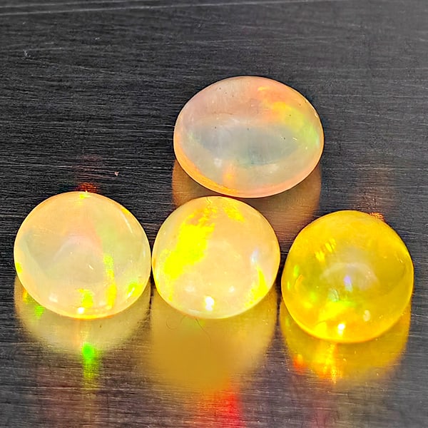 Natural Multi Color Opal Gemstones 1.45 Ct. 4 Pcs. Oval Cabochon Shape 5.3 x 4.4 Mm.: Product ID: 818728396 Product Name: Natural Opal Weight: 1.45 CT. Size: 5.3 x 4.4 x 3.6 MM. Shape: Oval Cabochon Color: Multi-Color Clarity:Semi - Transparent Luster: Good Gems Origin: Ethiopia Treatm