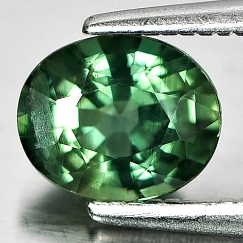 Natural Green Sapphire Gemstones 1.16 Ct. Oval Shape 6.8 x 5.6 Mm.: Product ID: 806146463 Product Name: Natural Green Sapphire Weight: 1.16 CT. Size: 6.8 x 5.6 x 3.6 MM. Shape: Oval Color: Green Clarity:SI Luster: Good Gems Origin: Thailand Treatment: Heated Crystal S