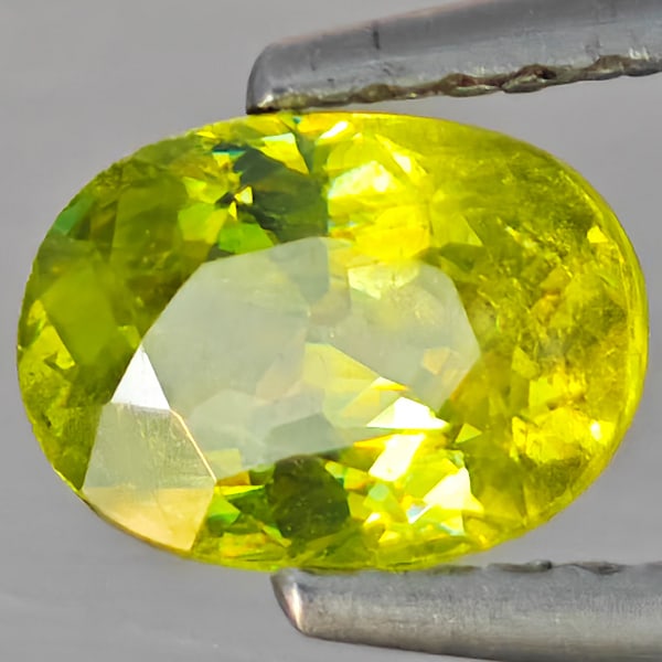 Natural Multi-Color With Rainbow Spark Sphene Gemstones 1.04 Ct. Oval Shape 7.2 x 5.2 Mm.: Product ID: 806509171 Product Name: Natural Sphene Weight: 1.04 CT. Size: 7.2 x 5.2 x 3.6 MM. Shape: Oval Shape Color: Multi-Color With Rainbow Spark Clarity:SI1 Luster: Good Gems Origin: Madagascar T