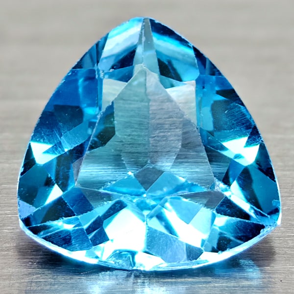 Natural Swiss Blue Topaz Gemstones 3.36 Ct. Trilliant Shape 9.1 Mm.: Product ID: 807167985 Product Name: Natural Blue Topaz Weight: 3.36 CT. Size: 9.1 x 9.1 x 5.8 MM. Shape: Trilliant Color: Swiss Blue Clarity:VSI Luster: Good Gems Origin: Brazil Treatment: Treated Cry