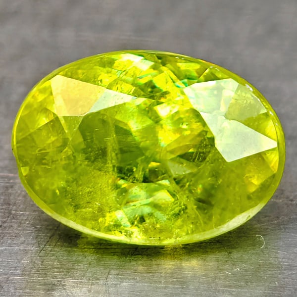 Natural Sphene Gemstones Intense Yellow Green Titanium Red Spark 0.77 Ct. Oval Shape 6.4 x 5 Mm.: Product ID: 806509030 Product Name: Natural Sphene Weight: 0.77 CT. Size: 6.4 x 5 x 3.5 MM. Shape: Oval Shape Color: Intense Yellow Green With Red Spark Clarity:SI1 Luster: Good Gems Origin: Madagasca