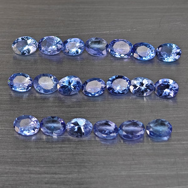 Natural Violetish Blue Tanzanite Gemstones 3.38 Ct. 18 Pcs. Oval Shape 4 x 3 Mm.: Product ID: 807015121 Product Name: Natural Tanzanite Weight: 3.38 CT. Size: 4 x 3 x 2.2 MM. Shape: Oval Color: Violetish Blue Clarity:VSI Luster: Good Gems Origin: Tanzania Treatment: Heated Crystal 