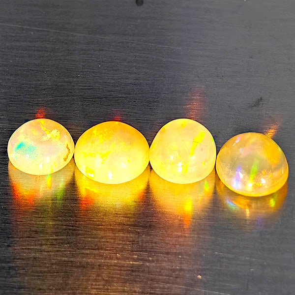 Natural Multi Color Opal Gemstones 1.74 Ct. 4 Pcs. Oval Cabochon Shape 5.5 x 5.1 Mm.: Product ID: 818728398 Product Name: Natural Opal Weight: 1.74 CT. Size: 5.5 x 5.1 x 3.4 MM. Shape: Oval Cabochon Color: Multi-Color Clarity:Semi - Transparent Luster: Good Gems Origin: Ethiopia Treatm
