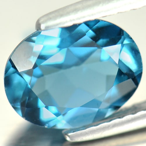 Natural London Blue Topaz Gemstones 1.93 Ct. Oval Shape 9 x 7 Mm.: Product ID: 807161054 Product Name: Natural Blue Topaz Weight: 1.93 CT. Size: 9 x 7 x 4 MM. Shape: Oval Color: London Blue Clarity:VSI Luster: Good Gems Origin: Brazil Treatment: Treated Crystal Struc