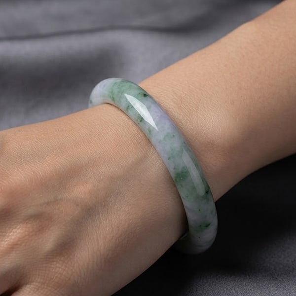 Natural Multi Color Jade Gemstones Bangle 319.77 Ct. Diameter 56 Mm.: Product ID: 819815212 Product Name: Natural Jade Weight: 319.77 CT. Size: 76 x 56 x 12 MM. Shape: Round Cabochon Color: Multi-Color Clarity:Opaque Luster: Good Gems Origin: Thailand Treatment: Unheate