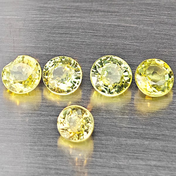 Natural Greenish Yellow Titanium Sphene Gemstones Rainbow Spark 1.13 Ct. 5 Pcs. Round Shape 3.3 Mm.: Product ID: 806509460 Product Name: Natural Sphene Weight: 1.13 CT. Size: 3.3 x 3.3 x 2.7 MM. Shape: Round Color: Greenish Yellow Titanium Rainbow Spark Clarity:SI1 Luster: Good Gems Origin: Madagasca