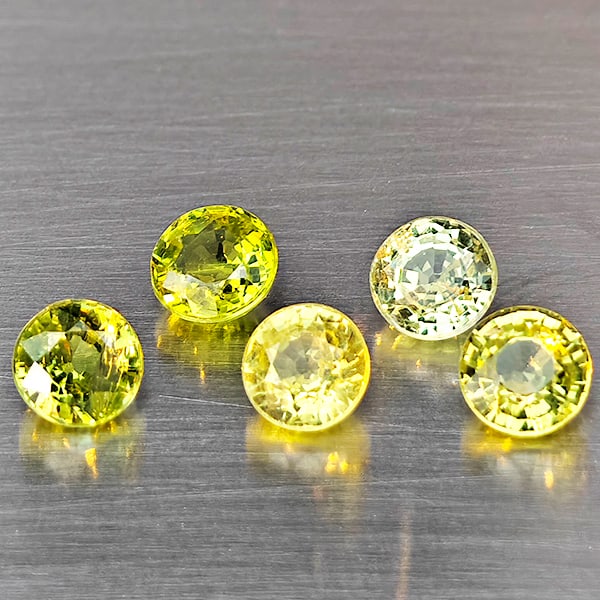 Natural Greenish Yellow Titanium Sphene Gemstones Rainbow Spark 1.65 Ct. 5 Pcs. Round Shape 4.1 Mm.: Product ID: 806509450 Product Name: Natural Sphene Weight: 1.65 CT. Size: 4.1 x 4.1 x 2.5 MM. Shape: Round Color: Greenish Yellow Titanium Rainbow Spark Clarity:SI1 Luster: Good Gems Origin: Madagasca
