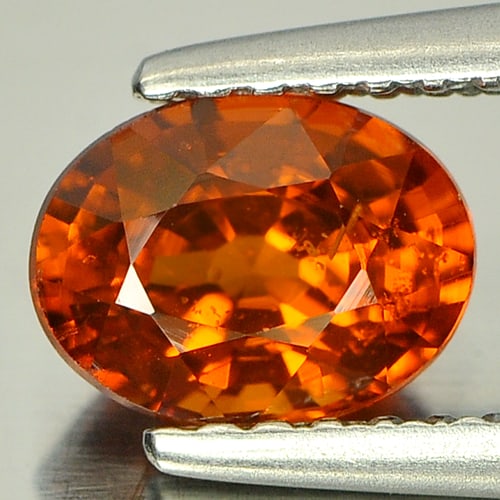 Natural Reddish Orange Spessartine Garnet Gemstones 1.03 Ct. Oval Shape 6.9 x 5.1 Mm.: Product ID: 802920984 Product Name: Natural Spessartine Weight: 1.03 CT. Size: 6.9 x 5.1 x 4 MM. Shape: Oval Color: Reddish Orange Clarity:SI Luster: Good Gems Origin: Nigeria Treatment: Unheated Crys