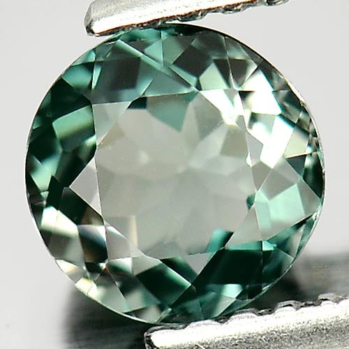 Natural Bluish Green Tourmaline Gemstones 0.79 Ct. Round Shape 6 Mm.: Product ID: 807246753 Product Name: Natural Tourmaline Weight: 0.79 CT. Size: 6 x 6 x 3.4 MM. Shape: Round Color: Bluish Green Clarity:VSI Luster: Good Gems Origin: Nigeria Treatment: Unheated Crystal