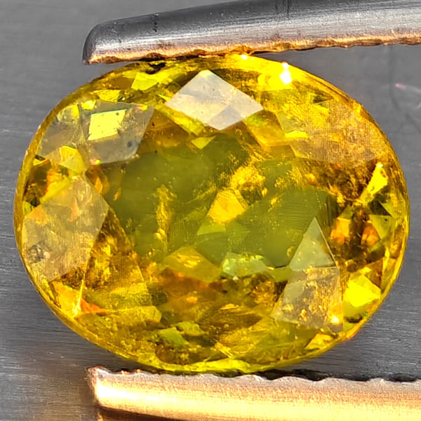 Natural Multi-Color With Rainbow Spark Sphene Gemstones 1.41 Ct. Oval Shape 7.9 x 6.4 Mm.: Product ID: 806509115 Product Name: Natural Sphene Weight: 1.41 CT. Size: 7.9 x 6.4 x 3.7 MM. Shape: Oval Shape Color: Multi-Color Clarity:SI1 Luster: Good Gems Origin: Madagascar Treatment: Unheated 