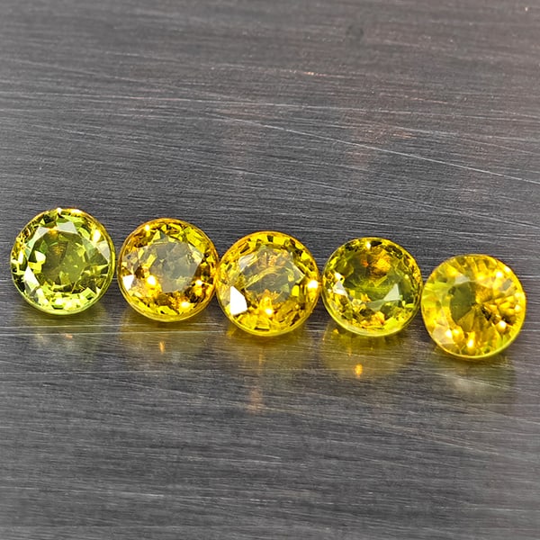Natural Greenish Yellow Titanium Sphene Gemstones Rainbow Spark 1.24 Ct. 5 Pcs. Round Shape 3.5 Mm.: Product ID: 806509431 Product Name: Natural Sphene Weight: 1.24 CT. Size: 3.5 x 3.5 x 2.7 MM. Shape: Round Color: Greenish Yellow Titanium Rainbow Spark Clarity:SI1 Luster: Good Gems Origin: Madagasca