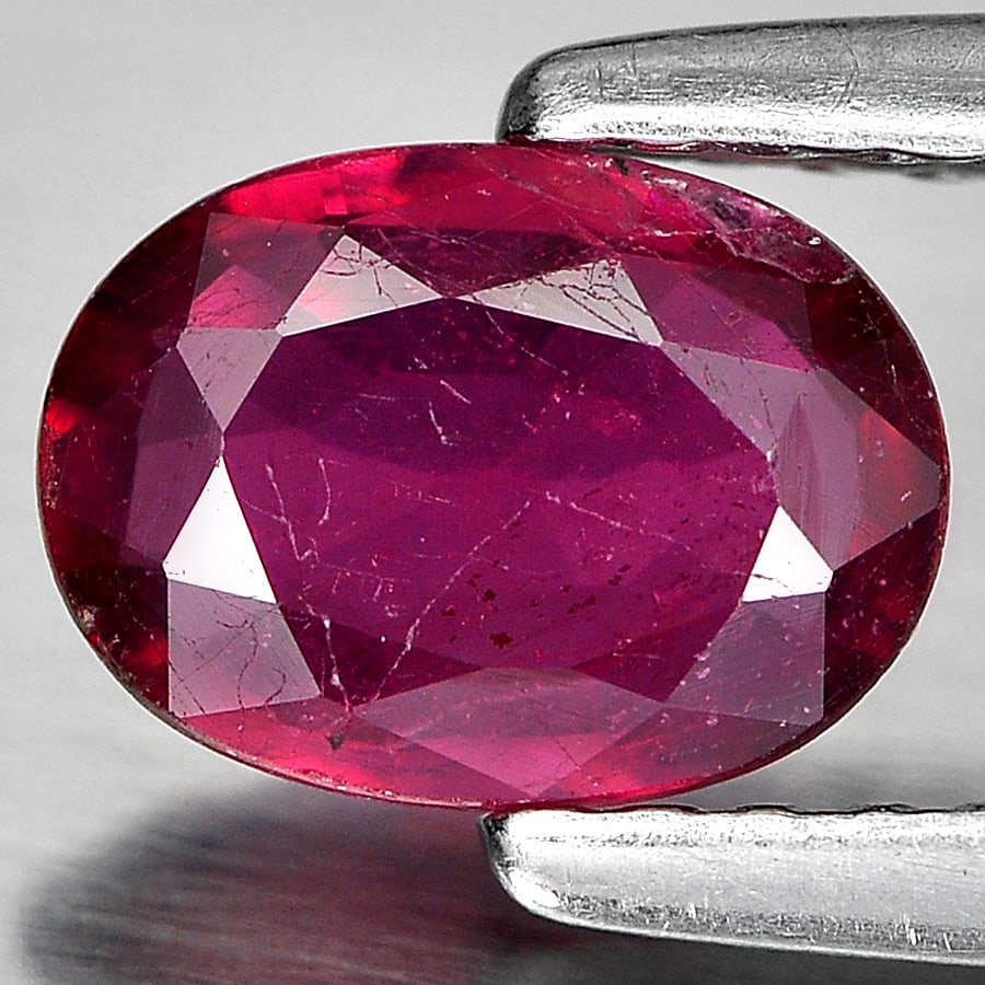Natural Purplish Red Ruby Gemstones 0.85 Ct. Oval Shape 7 x 5.2 Mm.: Product ID: 805934864 Product Name: Natural Ruby Weight: 0.85 CT. Size: 7 x 5.2 x 2.4 MM. Shape: Oval Color: Red Clarity:SI1 Luster: Good Gems Origin: Madagascar Treatment: Heated (Lead glass fillin C