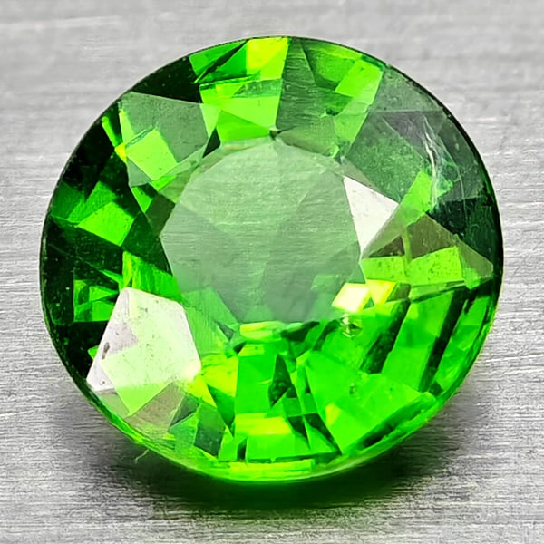 Natural Green Chrome Diopside Gemstones 0.46 Ct. Round Shape 5.1 Mm.: Product ID: 801608089 Product Name: Natural Chrome Diopside Weight: 0.46 CT. Size: 5.1 x 5.1 x 2.9 MM. Shape: Round Shape Color: Green Clarity:VSI - SI1 Luster: Good Gems Origin: Russia Treatment: Unh