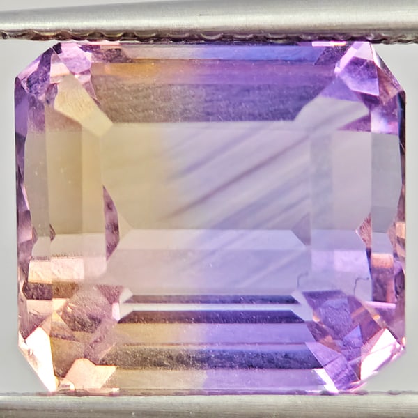 Natural Bi Color Ametrine Gemstones 5.19 Ct. Octagon Shape 10.2 x 9.2 Mm.: Product ID: 800408621 Product Name: Natural Ametrine Weight: 5.19 CT. Size: 10.2 x 9.2 x 7.5 MM. Shape: Octagon Color: Bi Color Clarity:VVS Luster: Good Gems Origin: Bolivia Treatment: Unheated Crysta