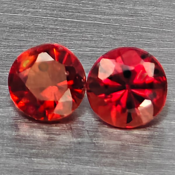 Natural Orangish Red Songea Sapphire Gemstones 0.55 Ct. 2 Pcs. Round Diamond Cut 3.4 Mm.: Product ID: 806162814 Product Name: Natural Red Sapphire Weight: 0.55 CT. Size: 3.2 x 3.2 x 2.4 MM. Shape: Round Diamond Cut Color: Orangish Red Clarity:SI1 Luster: Good Gems Origin: Tanzania Treatmen