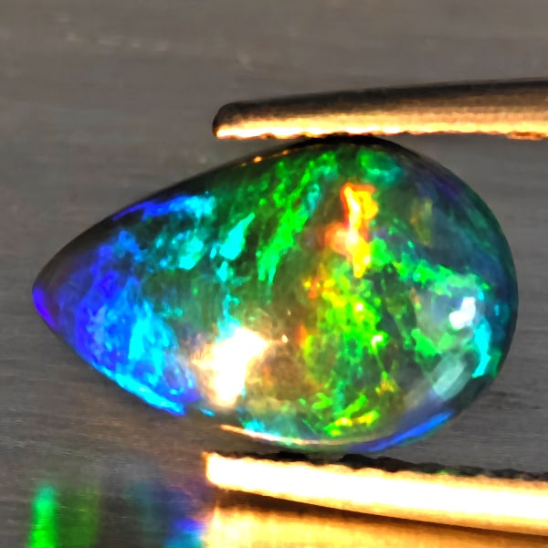 Natural Multi Color Opal Gemstones 1.36 Ct. Pear Cabochon Shape 11.5 x 7.5 Mm.: Product ID: 818728540 Product Name: Natural Opal Weight: 1.36 CT. Size: 11.5 x 7.5 x 3.6 MM. Shape: Pear Cabochon Color: Multi-Color Clarity:Semi - Transparent Luster: Strong Iridescent Gems Origin: E
