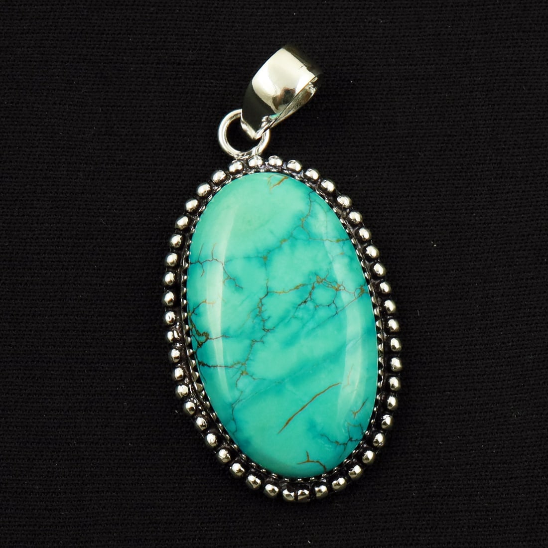 Natural Turquoise Sterling Silver Plated Handmade Pendant: Product ID: 260714170000 Product - Handmade Silver Plated Pendant Metal - 92.5 Sterling Silver Plated Pendant Size - 3.5x2 CM Gemstone - Turquoise Gemstone Origin - Tibet Gemstone Shape - Oval Pendant