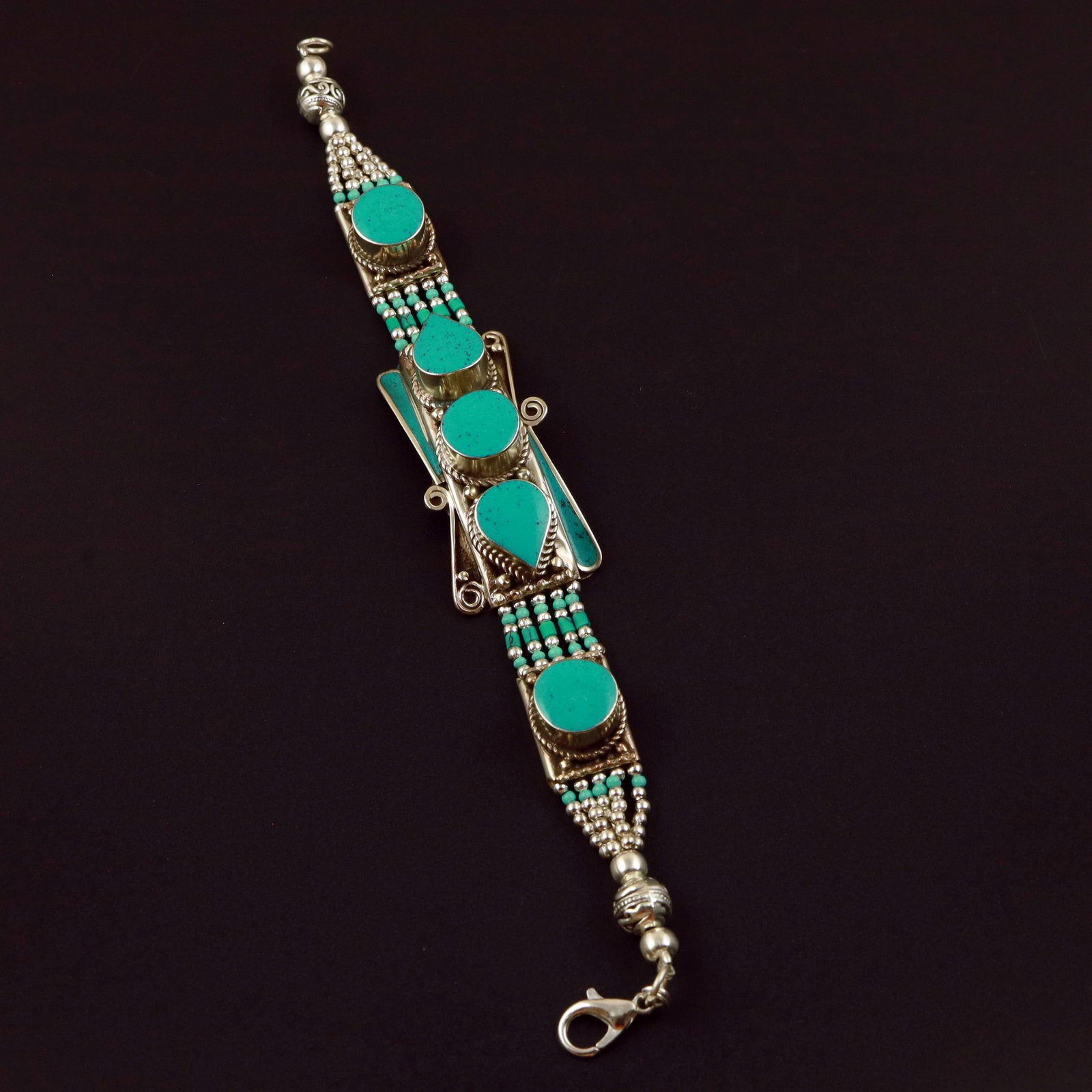 Tibetan Natural Turquoise Handmade Bold Bracelet: Product ID: 260513132621 Product - Tibetan Handmade Ethnic Bracelet Gemstone - Natural Turquoise Size - 7 Inch Weight - 50 Gram Approx Metal - Brass & Copper mix Metal Origin - Nepal Country/Region of