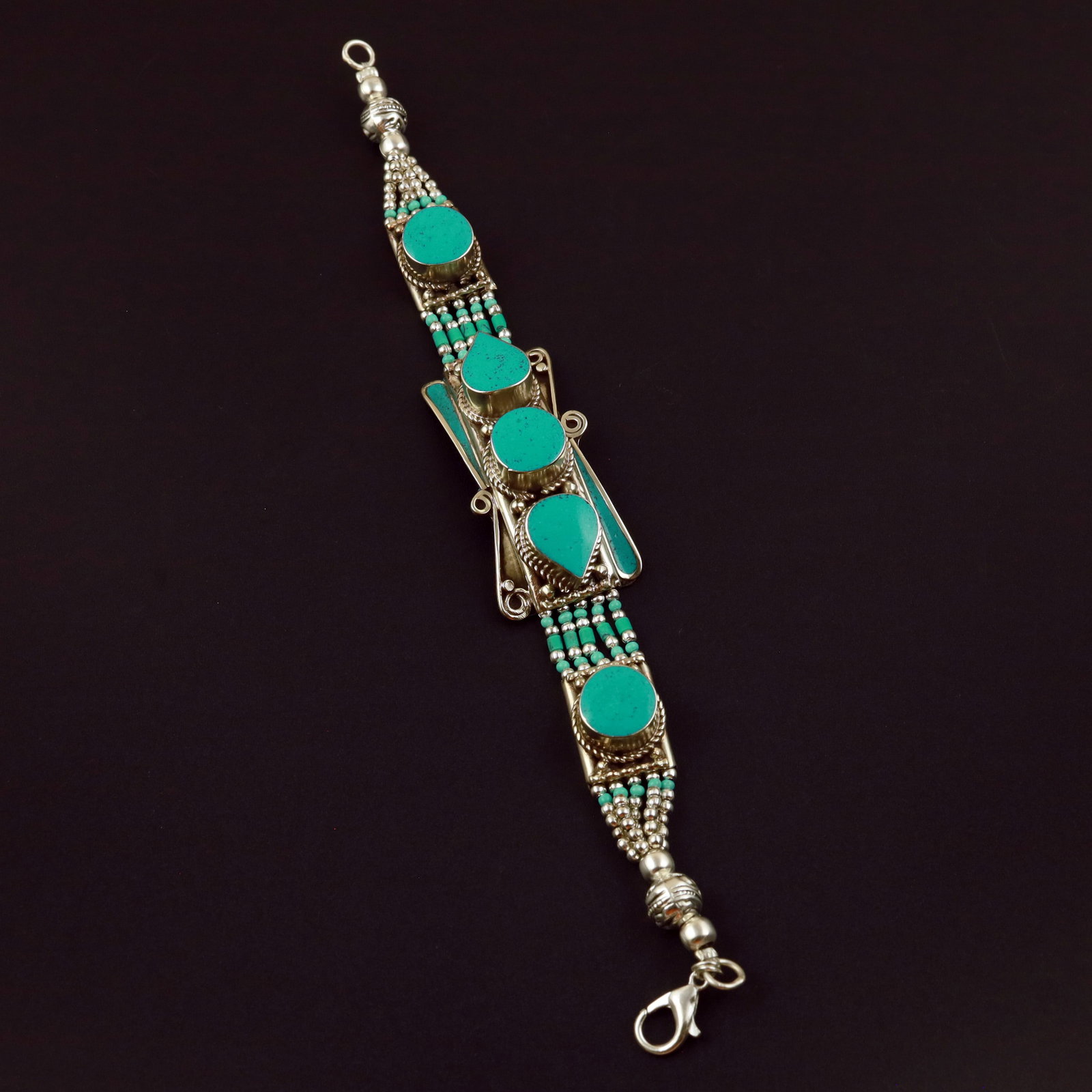 Tibetan Turquoise Handmade Designer Bold Bracelet: Product ID: 260513132542 Product - Tibetan Handmade Ethnic Bracelet Gemstone - Natural Turquoise Size - 7 Inch Weight - 50 Gram Approx Metal - Brass & Copper mix Metal Origin - Nepal Country/Region of