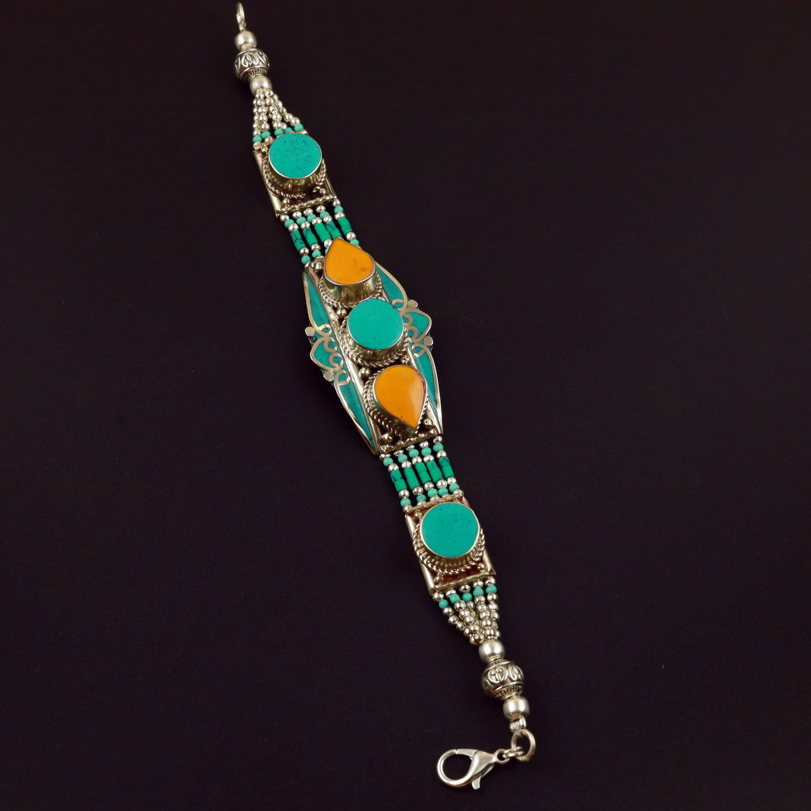 Tibetan Turquoise & Copal Handmade Asian Bracelet: Product ID: 260513132115 Product - Tibetan Handmade Ethnic Bracelet Gemstone - Natural Turquoise & Copal Size - 7 Inch Weight - 50 Gram Approx Metal - Brass & Copper mix Metal Origin - Nepal Country/R