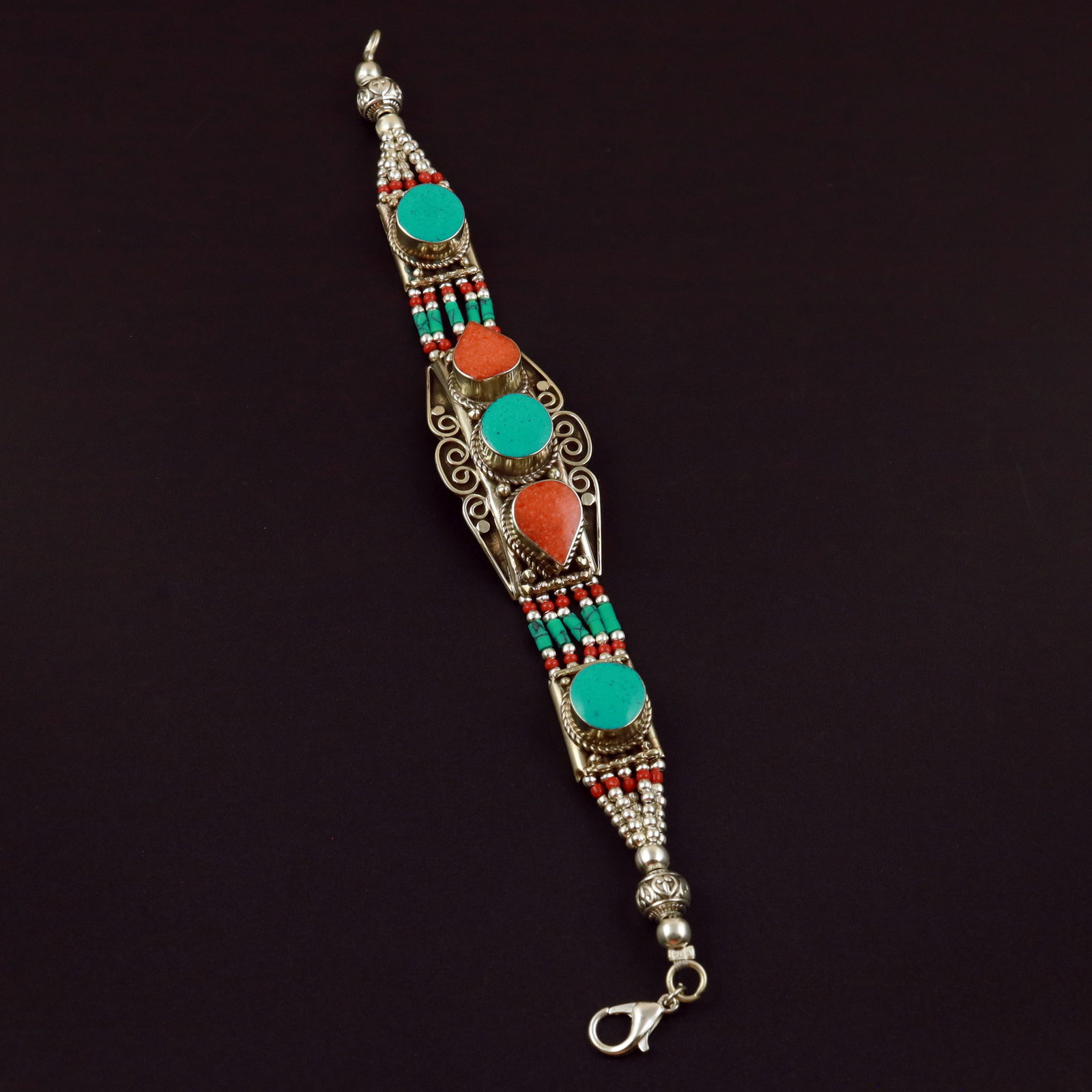Tibetan Natural Turquoise & Coral Handmade Bold Bracelet: Product ID: 260513131735 Product - Tibetan Handmade Ethnic Bracelet Gemstone - Natural Turquoise & Coral Size - 7 Inch Weight - 50 Gram Approx Metal - Brass & Copper mix Metal Origin - Nepal Country/R