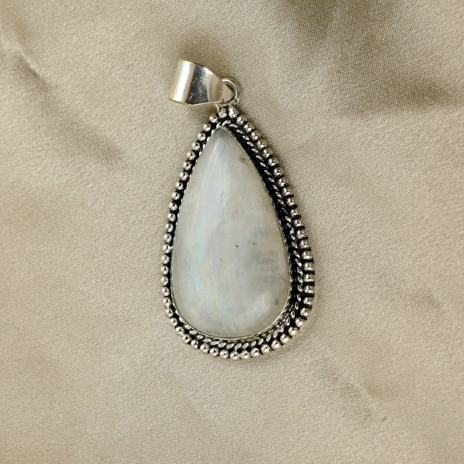 Natural Rainbow Moonstone Sterling Silver Plated Handmade Pendant: Product ID: 260513111212 Product - Handmade Silver Plated Pendant Metal - 92.5 Sterling Silver Plated Pendant Size - 4.5x2.5 CM Gemstone - Rainbow Moonstone Gemstone Origin - India Gemstone Shape - Pe