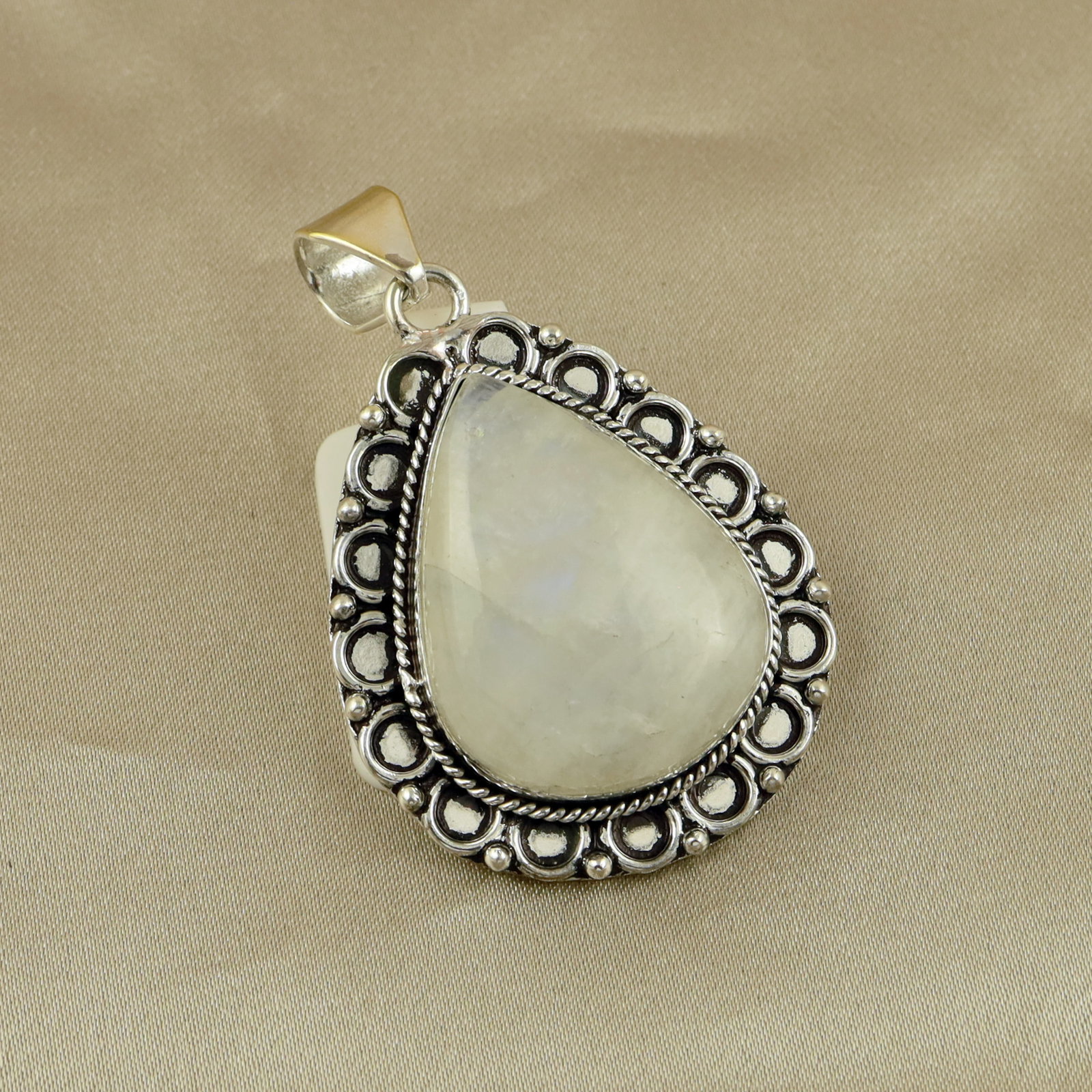 Natural Rainbow Moonstone Sterling Silver Plated Handmade Pendant: Product ID: 260513110953 Product - Handmade Silver Plated Pendant Metal - 92.5 Sterling Silver Plated Pendant Size - 3.5x3 CM Gemstone - Rainbow Moostone Gemstone Origin - India Gemstone Shape - Pear 