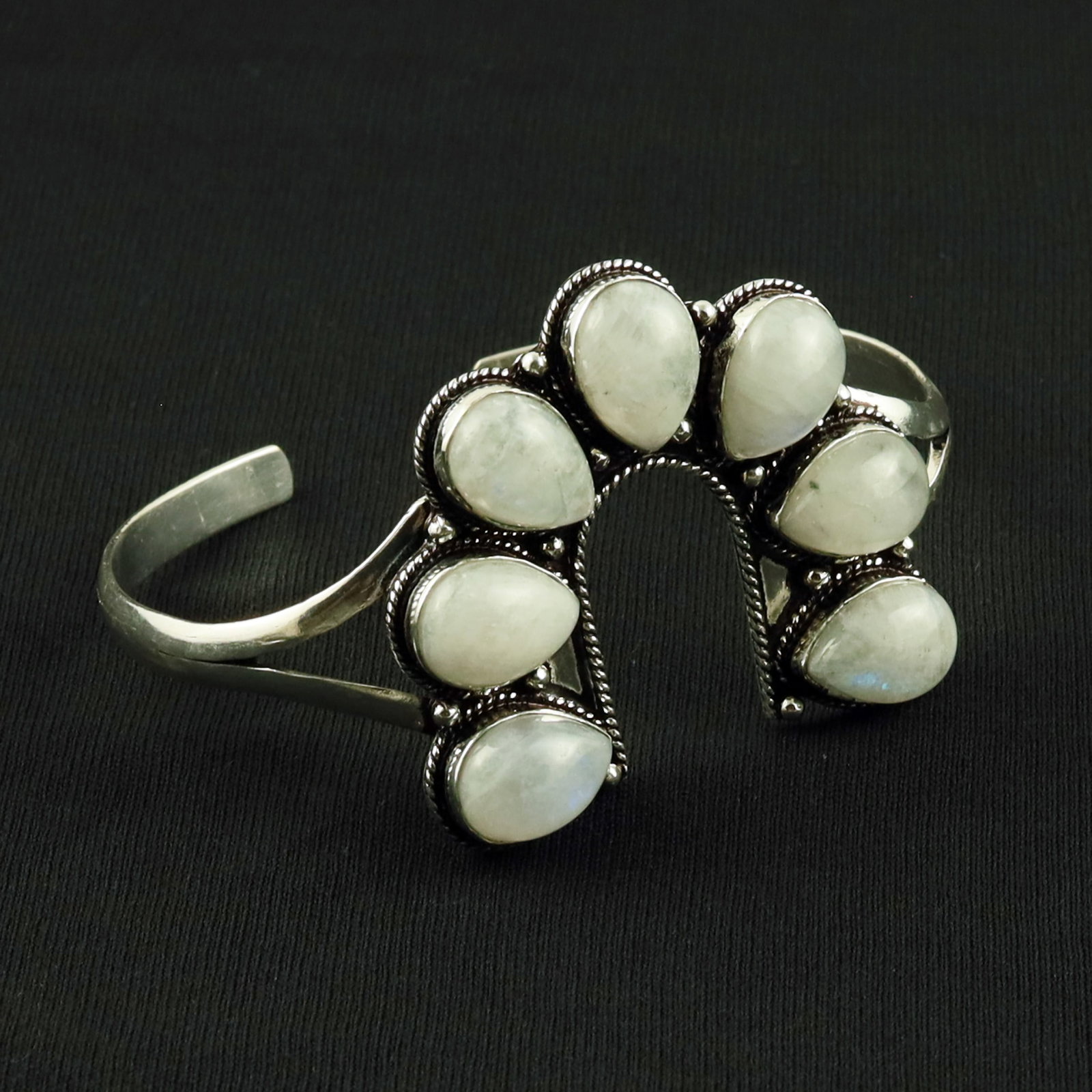 Natural Rainbow Moonstone Sterling Silver Plated Handmade Cuff Bangle: Product ID: 260617120723 Product - Handmade Silver Plated Cuff Bangle Metal - 92.5 Sterling Silver Plated Bangle Size - 7.5x5 CM (Adjustable) Gemstone - Rainbow Moonstone Gemstone Origin - India Gemst
