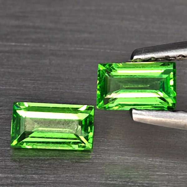 Natrual Green Tsavorite Garnet Gemstones 0.54 Ct. 2 Pcs. Baguette Shape 5 x 2.8 Mm.: Product ID: 803000931 Product Name: Natural Tsavorite Weight: 0.54 CT. Size: 5 x 2.8 x 1.7 MM. Shape: Baguette Color: Green Clarity:VSI Luster: Good Gems Origin: Tanzania Treatment: Unheated Crystal S