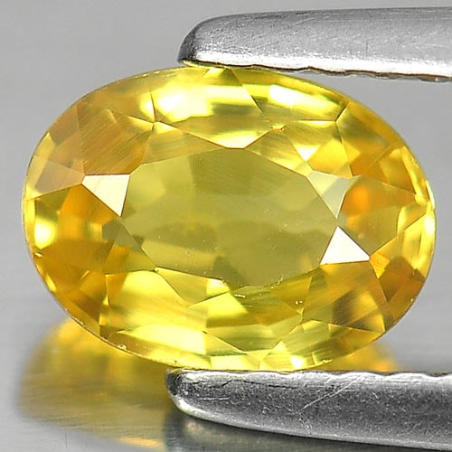 Natural Yellow Sapphire Gemstones 1.13 Ct. Oval Shape 7.1 x 5.2 Mm.: Product ID: 806150899 Product Name: Natural Yellow Sapphire Weight: 1.13 CT. Size: 7.1 x 5.2 x 3.2 MM. Shape: Oval Color: Yellow Clarity:VVS Luster: Very Good Gems Origin: Thailand Treatment: Heated C