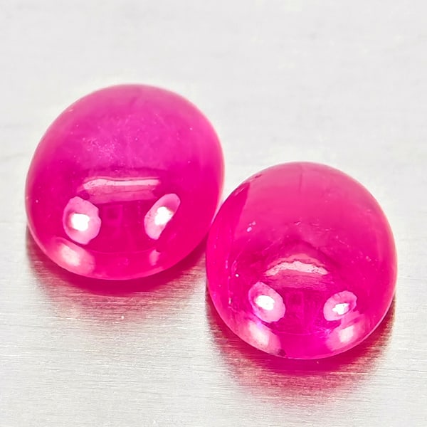 Natural Pink Red Jonson Ruby Gemstones 1.07 Ct. 2 Pcs. Oval Cabochon Shape 5.1 x 4.1 Mm.: Product ID: 805935703 Product Name: Natural Ruby Weight: 1.07 CT. Size: 5.1 x 4.1 x 2.4 MM. Shape: Oval Cabochon Color: Pink Red Clarity:Semi - Transparent Luster: Good Gems Origin: Mozambique Treatme