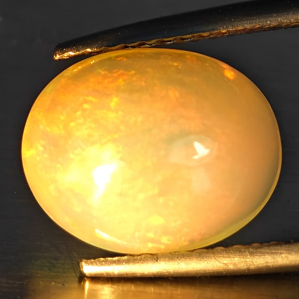Natural Multi-Color Play Of Colour Opal Gemstone 3.43 Ct. Oval Cabochon Shape 12 x 9.5 Mm.: Product ID: 708700134 Product Name: Natural Opal Weight: 3.43 CT. Size: 12 x 9.5 x 6.9 MM. Shape: Oval Cabochon Color: Multi-Color Clarity:Opaque Luster: Good Gems Origin: Ethiopia Treatment: Unheated