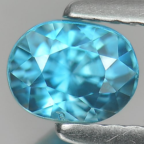 Natural Blue Zircon Gemstones 1.18 Ct. Oval Shape 5.7 x 4.5 Mm.: Product ID: 807713135 Product Name: Natural Zircon Weight: 1.18 CT. Size: 5.7 x 4.5 x 4.6 MM. Shape: Oval Color: Blue Clarity:VSI Luster: Good Gems Origin: Cambodia Treatment: Heated Crystal Structure